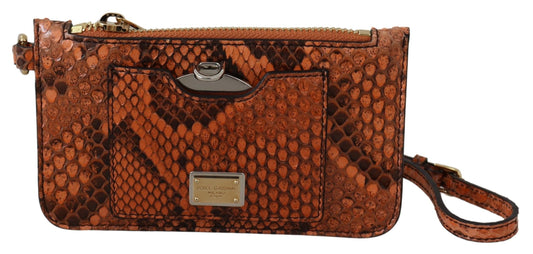 Brown snake skin patterned clutch bag with a strap on a white background