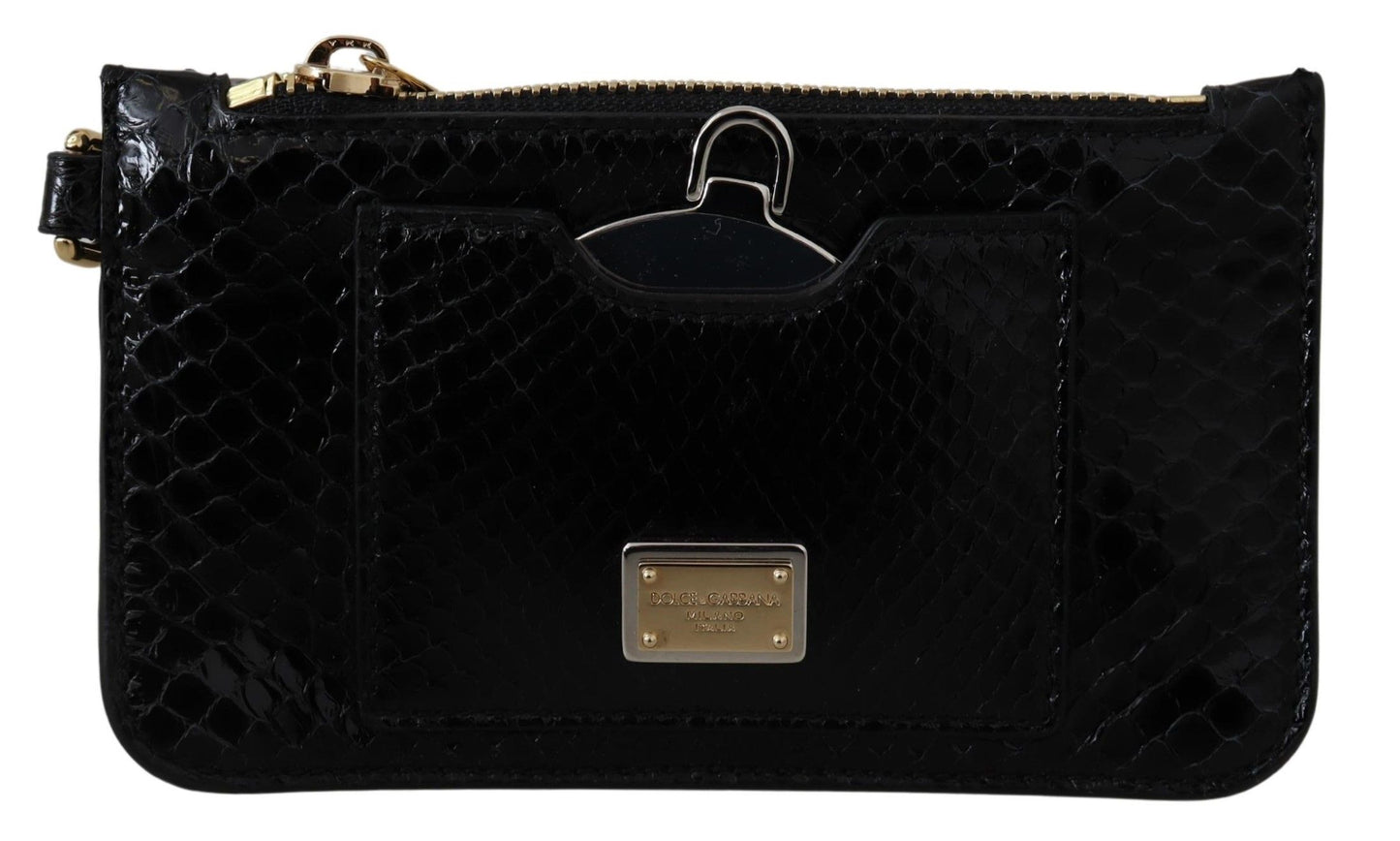 Black quilted clutch bag with gold accents on a white background