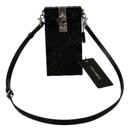 Black textured handbag with a strap and Dolce & Gabbana tag on a white background