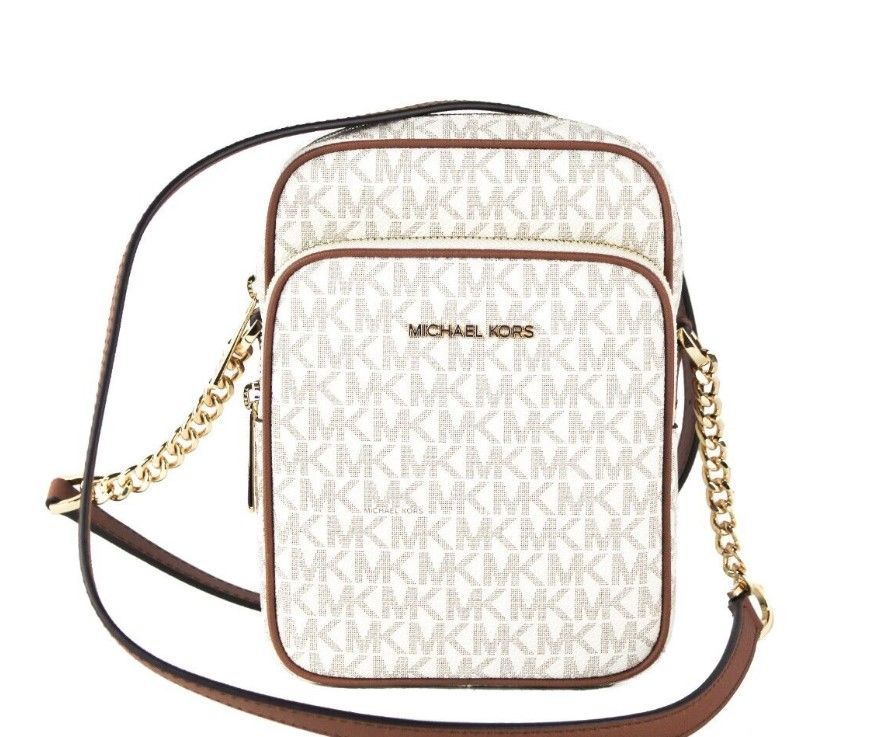 Michael Kors crossbody bag with gold chain strap on a white background