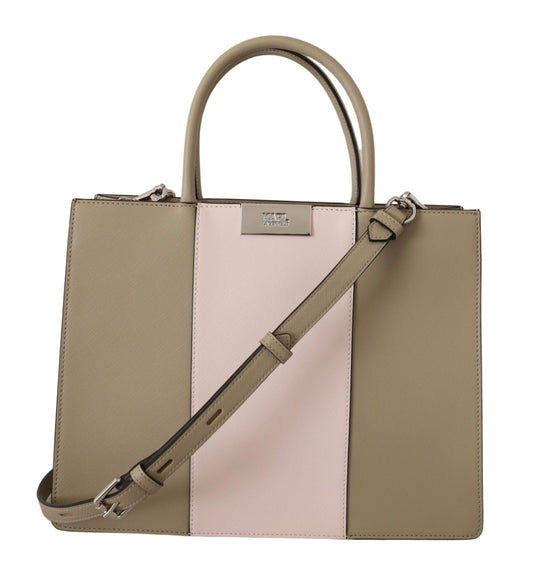 Two-tone handbag with beige and pink sections on a white background