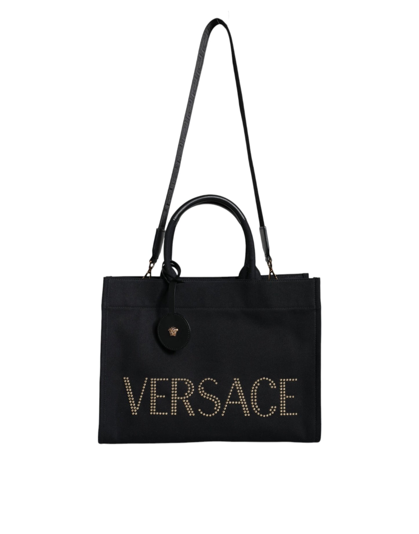 Black Versace tote bag with gold lettering on a white background