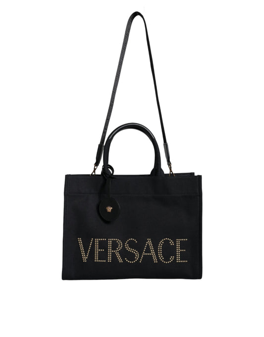 Black Versace tote bag with gold lettering on a white background