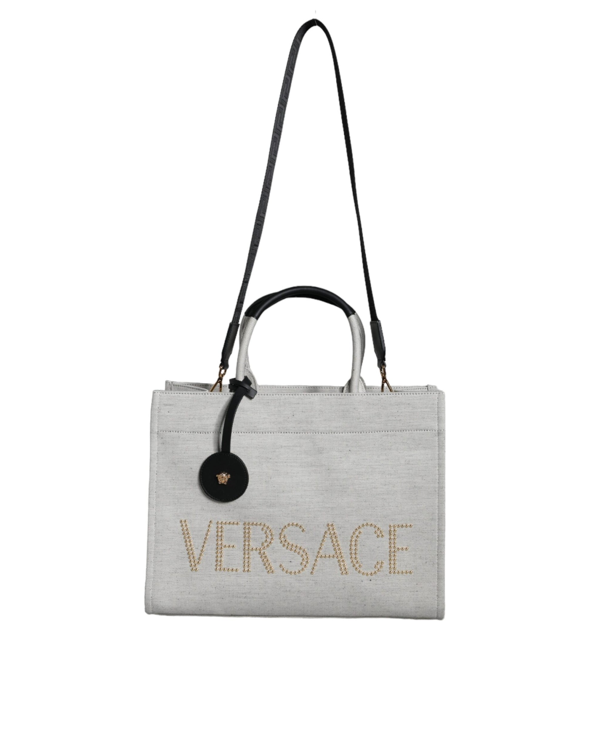 Gray handbag with 'Versace' branding on a white background
