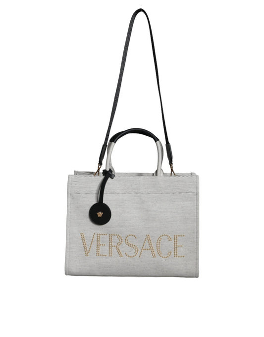 Gray handbag with 'Versace' branding on a white background