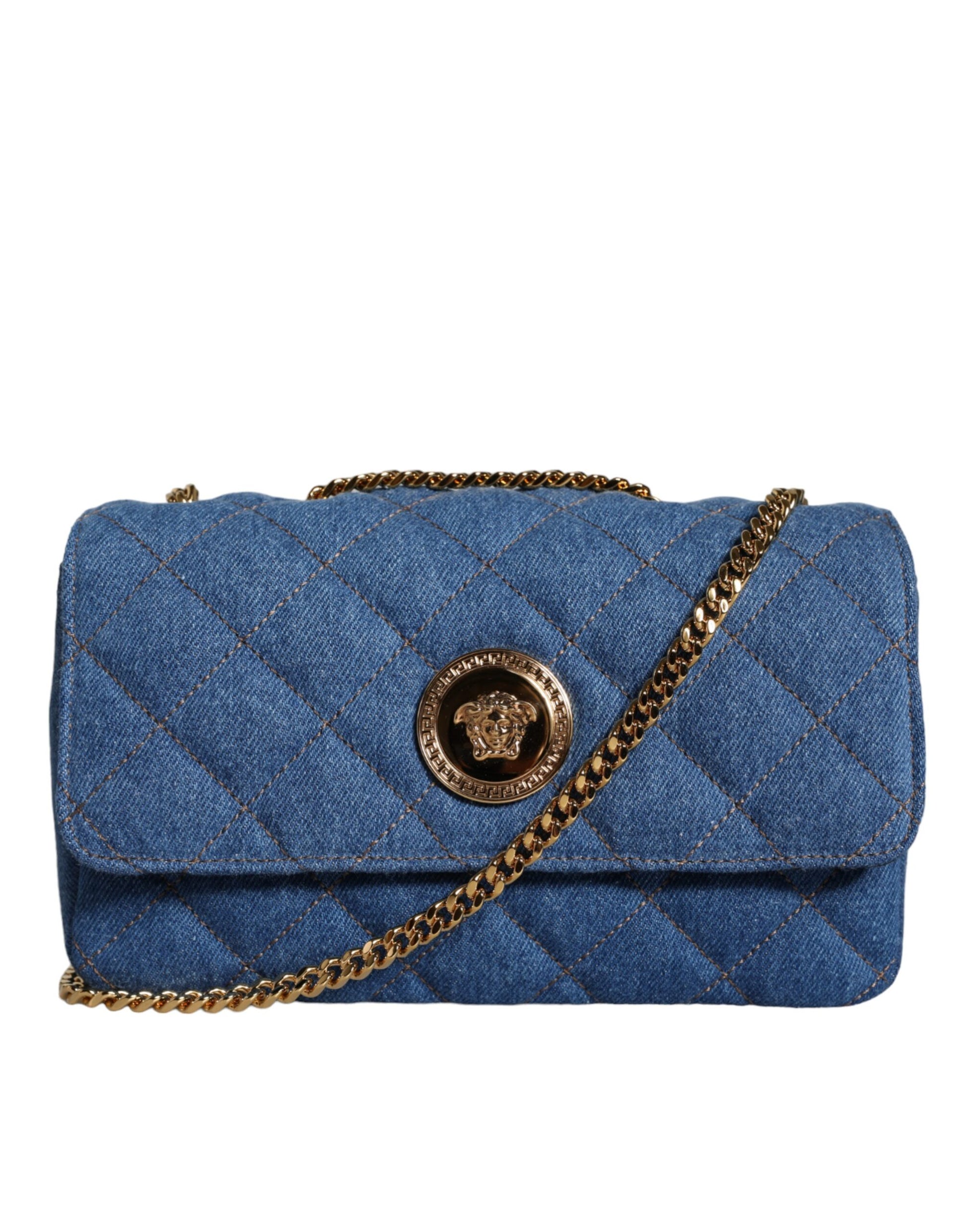 Blue quilted handbag with gold chain and emblem on a white background