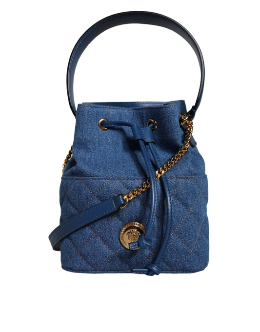 Blue denim handbag with gold chain and logo on a white background
