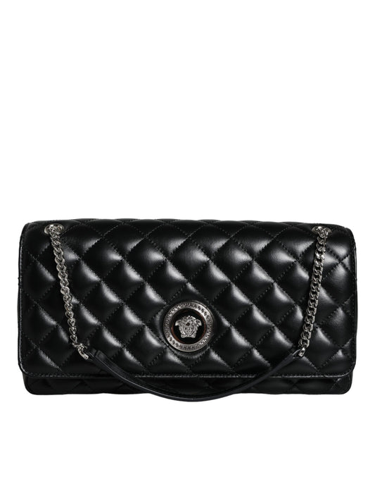 Black quilted handbag with chain strap on a white background