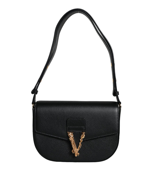 Black handbag with a gold emblem on a white background