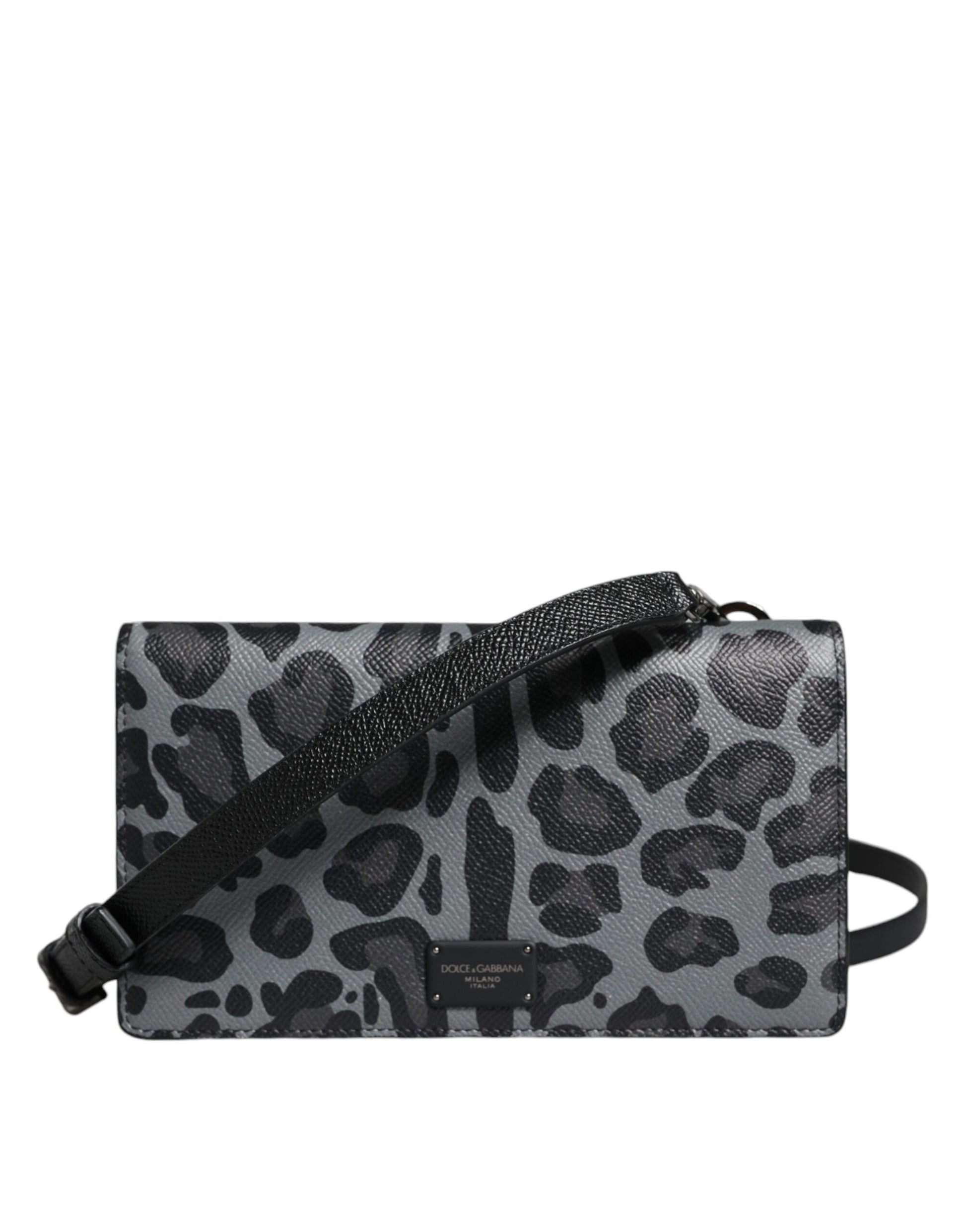 Leopard print handbag with a black strap on a white background