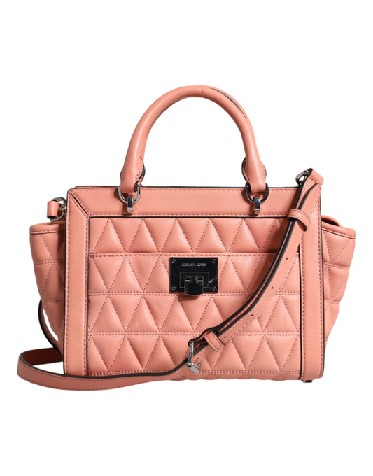 Quilted pink handbag with a black strap on a white background