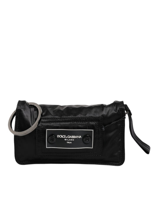 Black handbag with a visible brand label on a white background