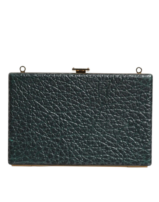 Green leather clutch bag on a white background