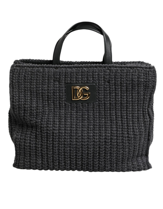 Dark gray woven handbag with a gold logo on a white background