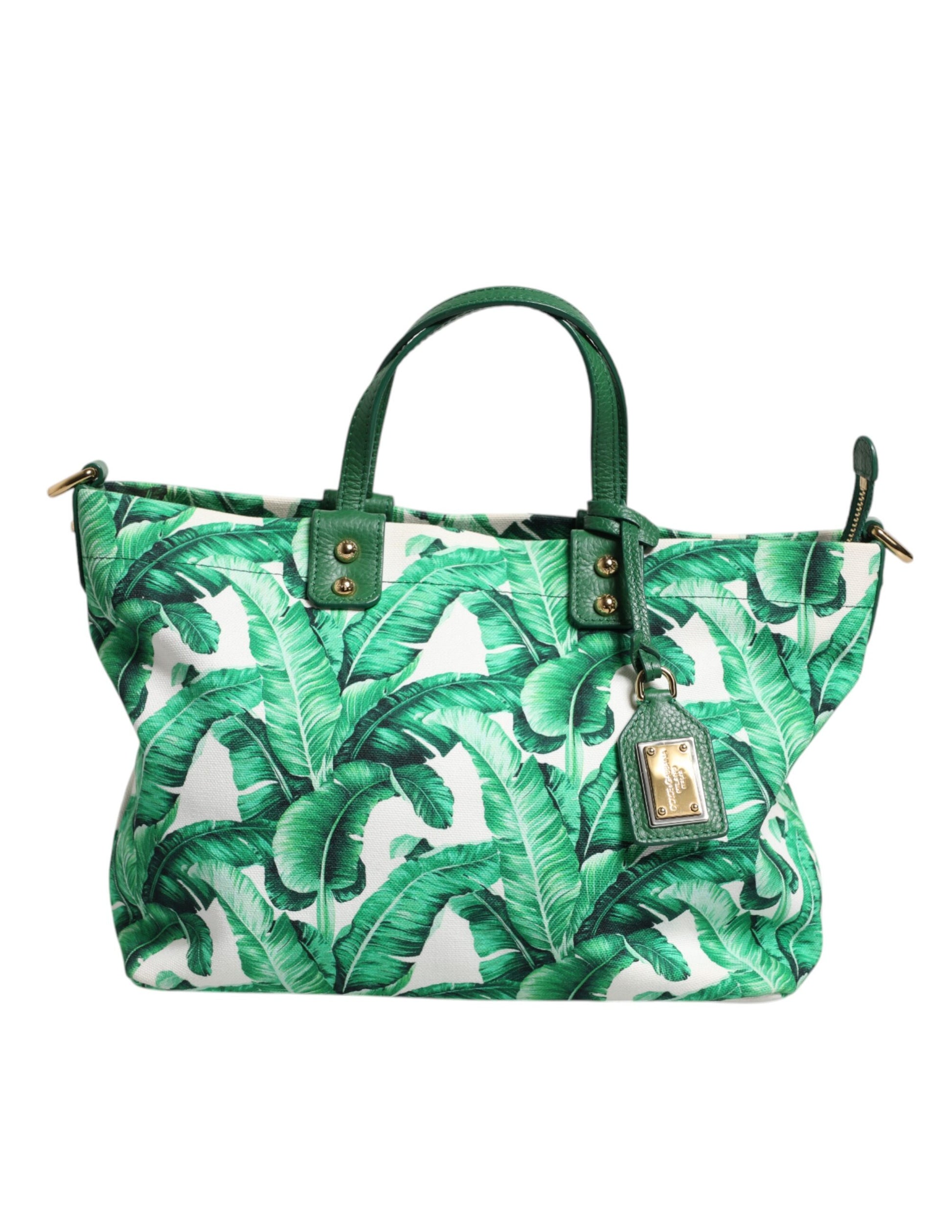 Green handbag with palm leaf pattern on a white background