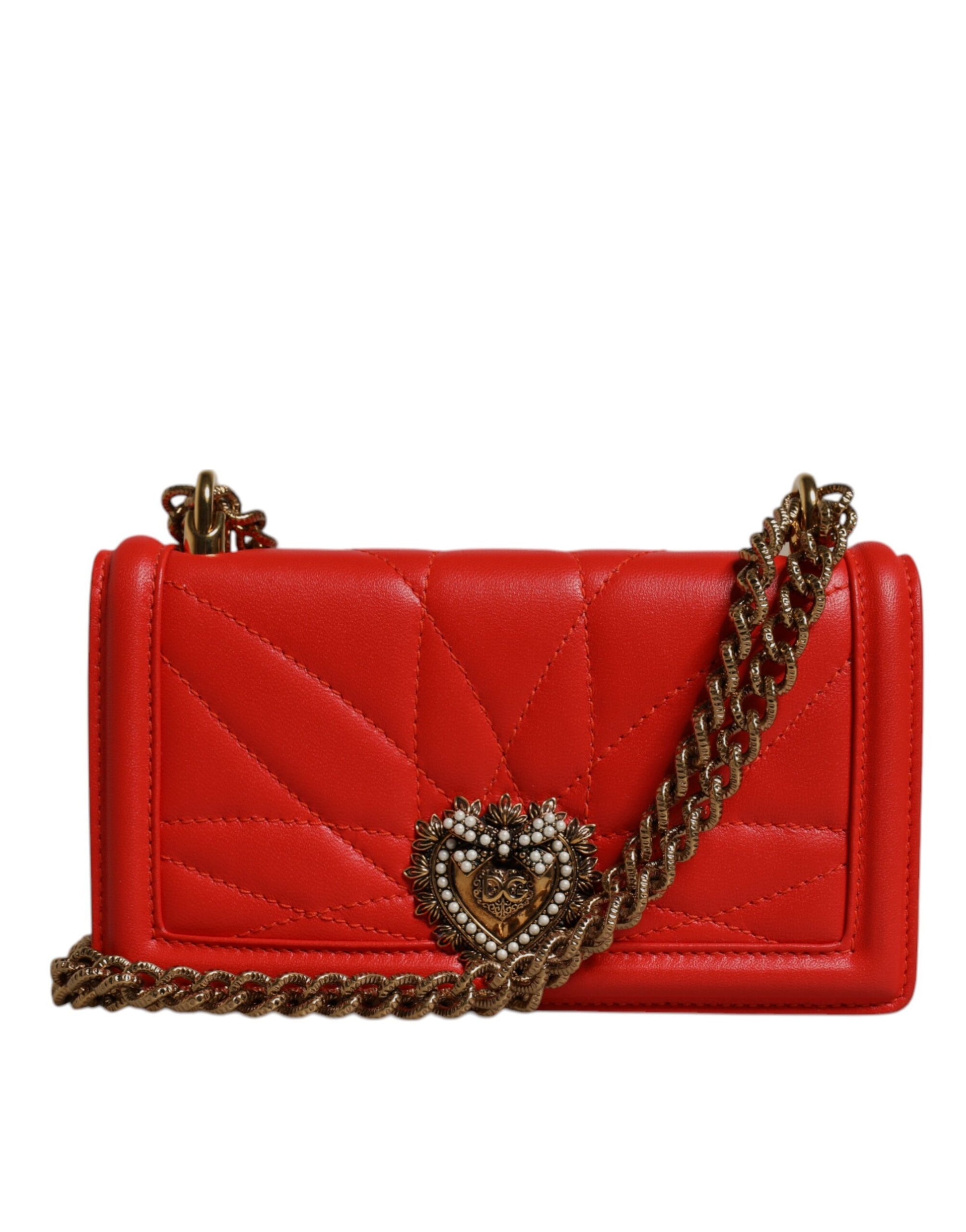 Red quilted handbag with a gold chain and heart detail on a white background