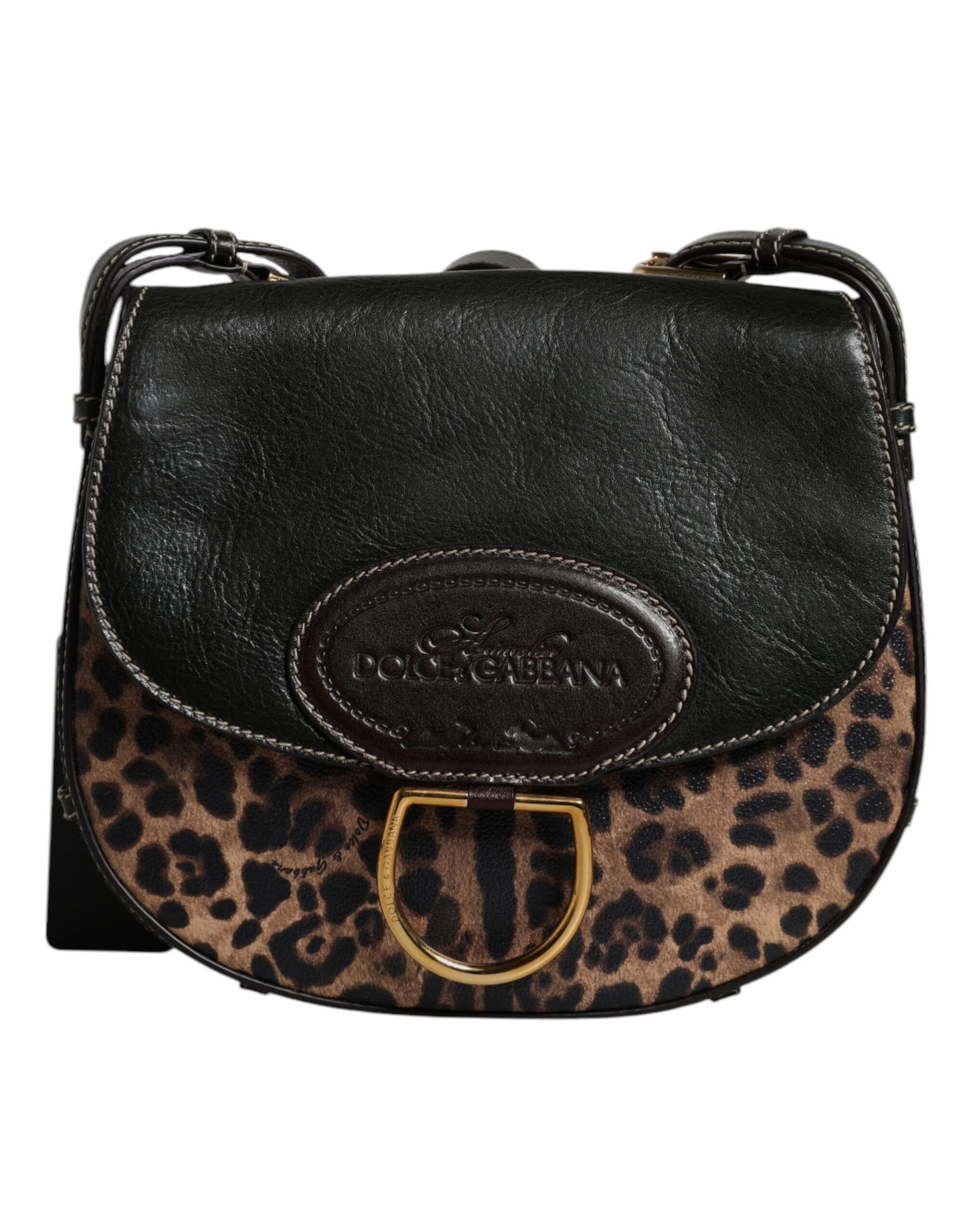 Black leather handbag with leopard print flap and gold D-ring on a white background