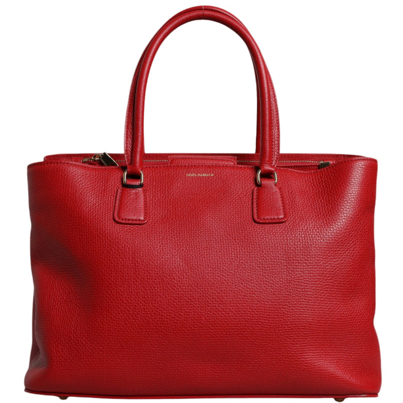 Red leather handbag on a white background