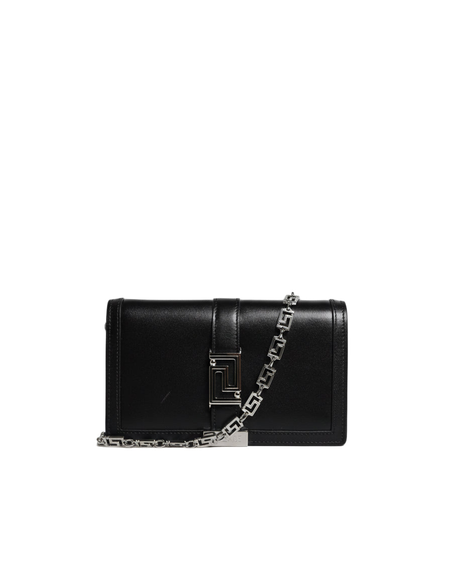 Black handbag with a chain detail on a white background