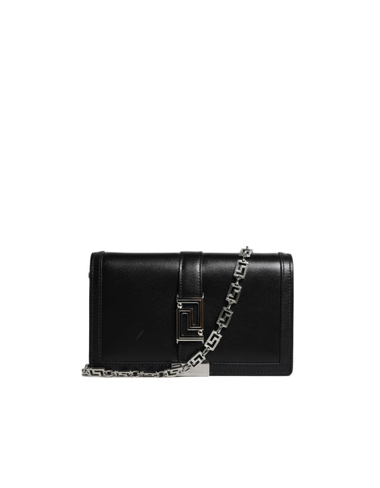 Black handbag with a chain detail on a white background