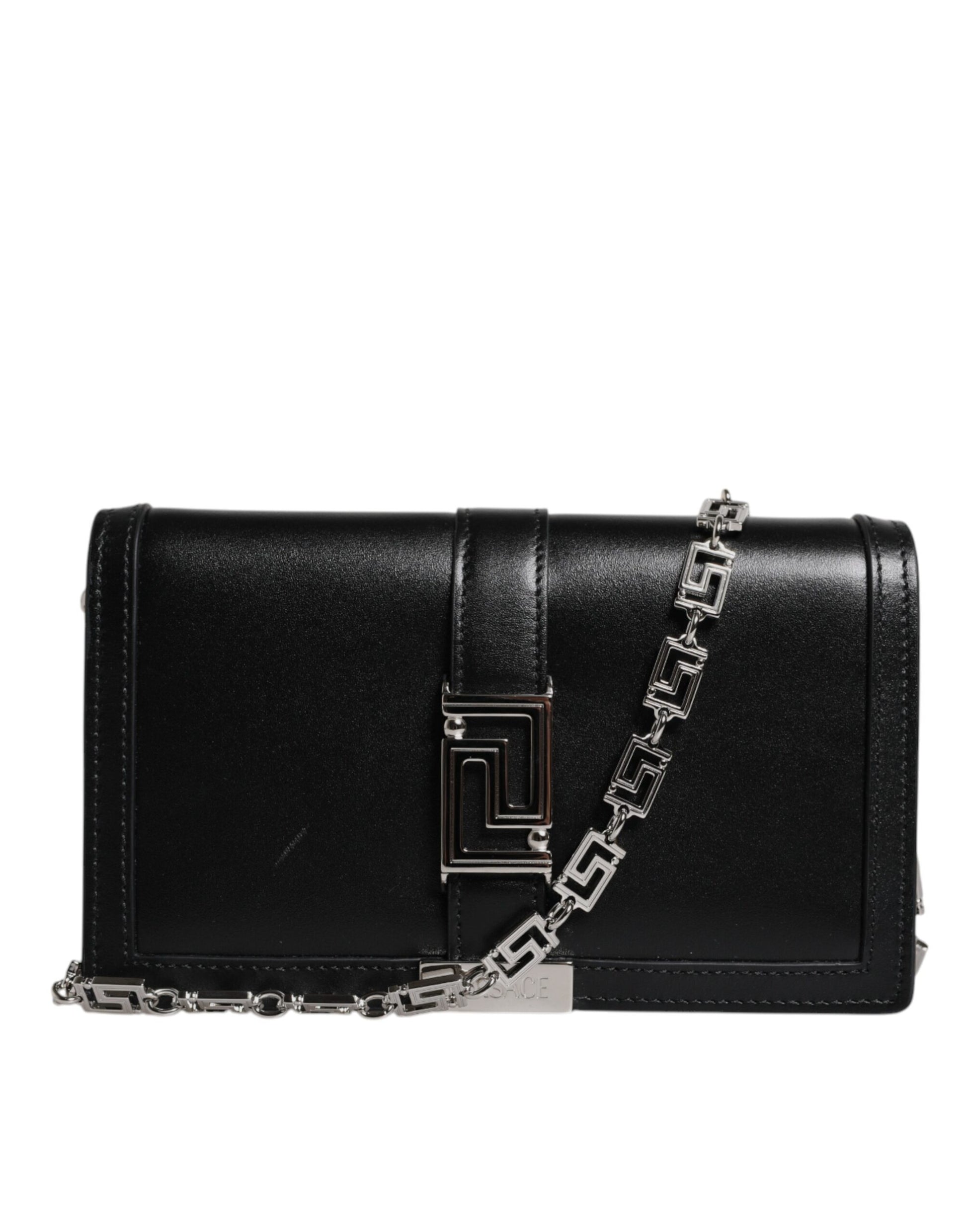 Black handbag with a chain detail on a white background