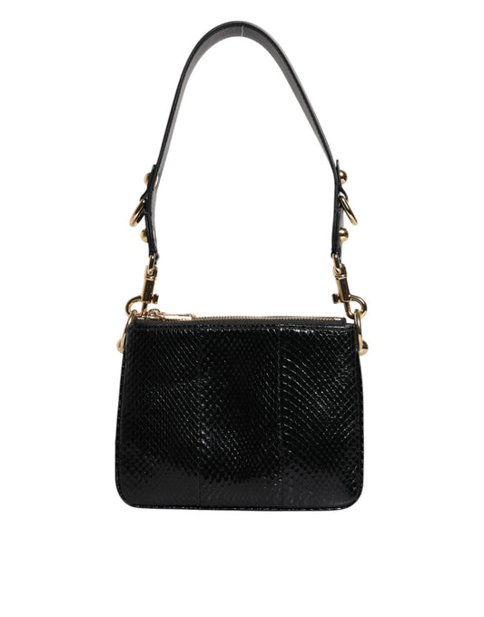 Black handbag with gold accents on a white background
