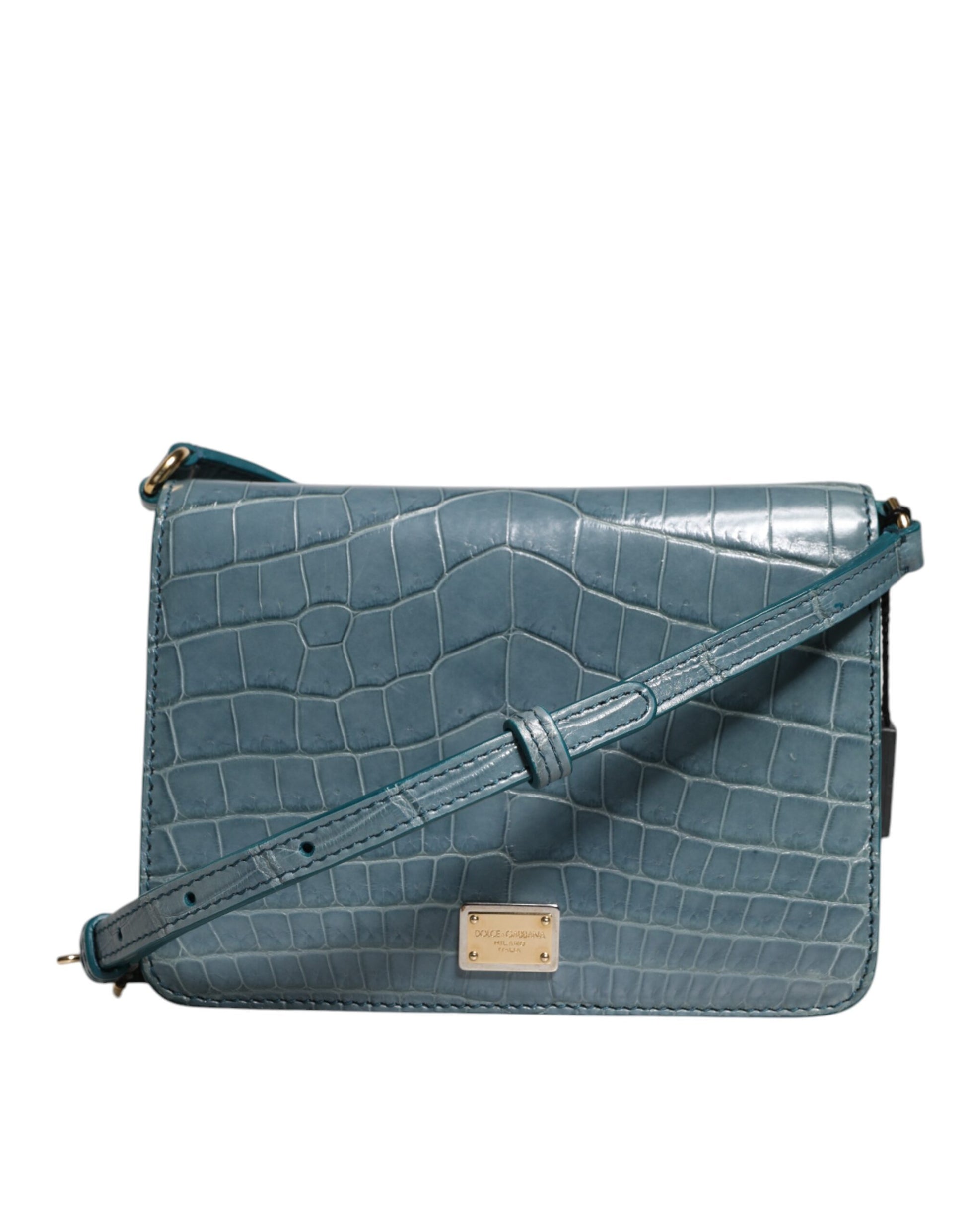 Blue crocodile-patterned handbag with a visible brand label on a white background