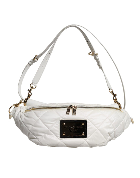 White quilted handbag with gold accents on a white background