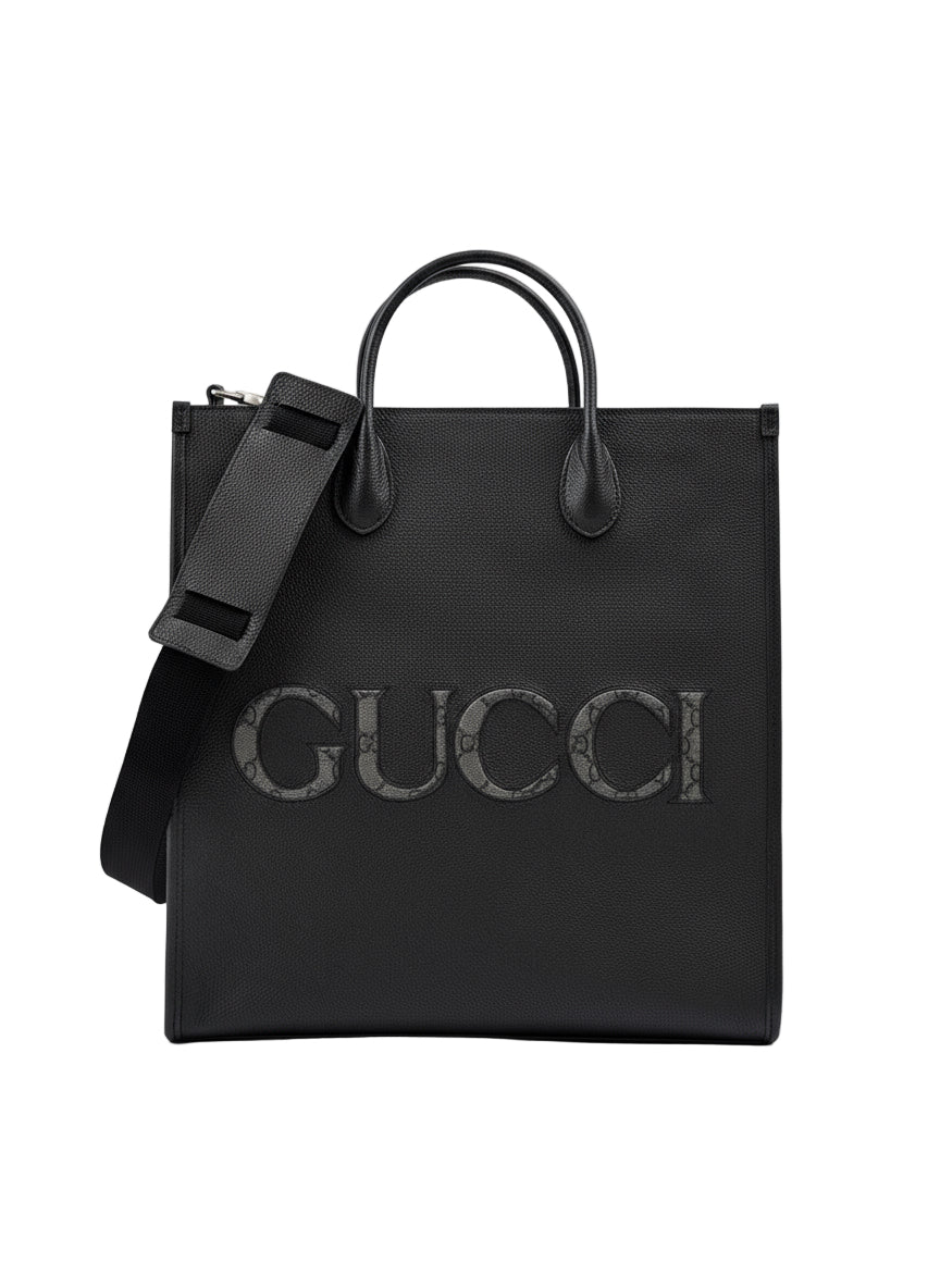 Black Gucci tote bag with a shoulder strap on a white background