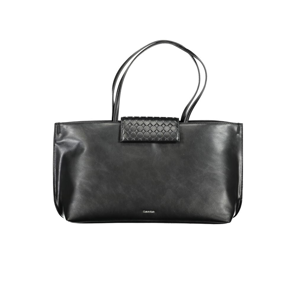 Black handbag with a textured patch on a white background