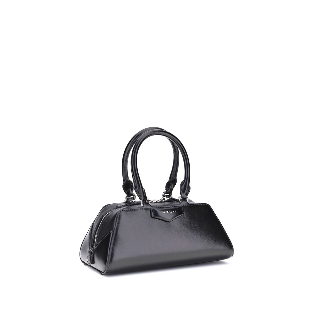 Black handbag on a white background