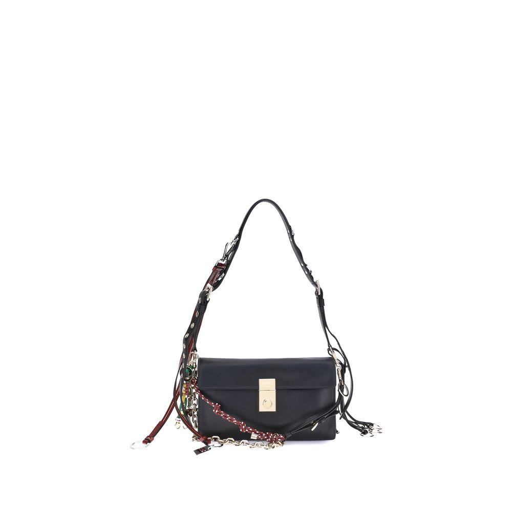 Black handbag with a decorative strap on a white background