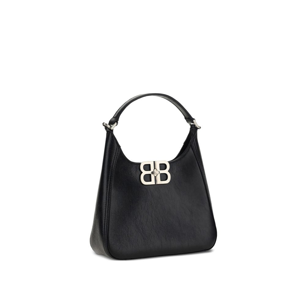 Black handbag with a silver clasp on a white background