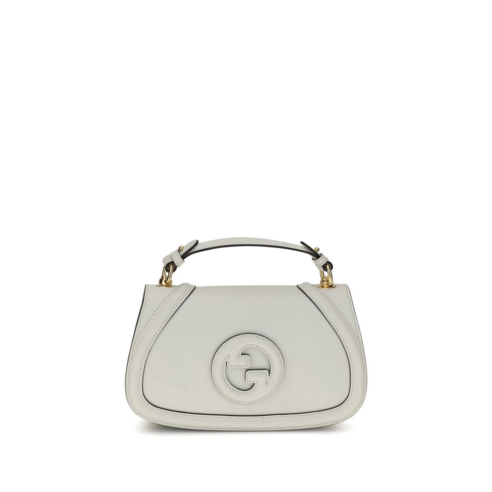 White handbag with a brand logo on a white background