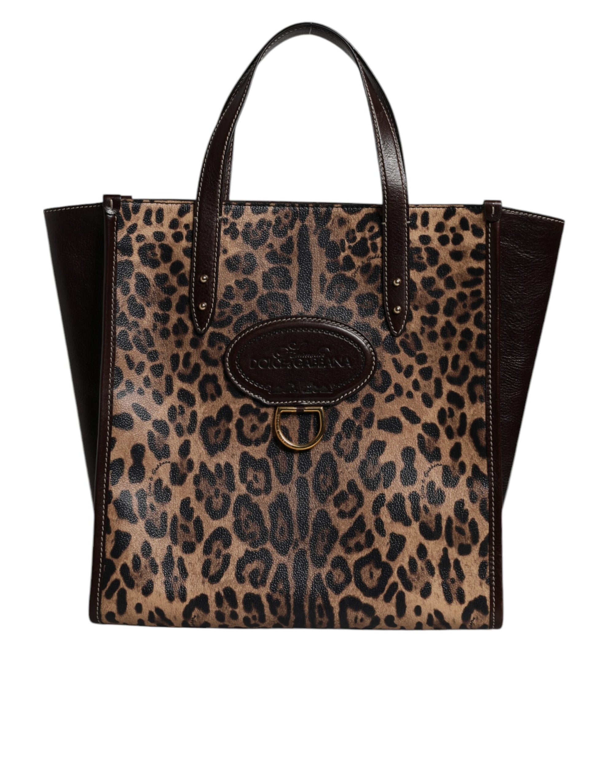 Leopard print handbag with black accents on a white background