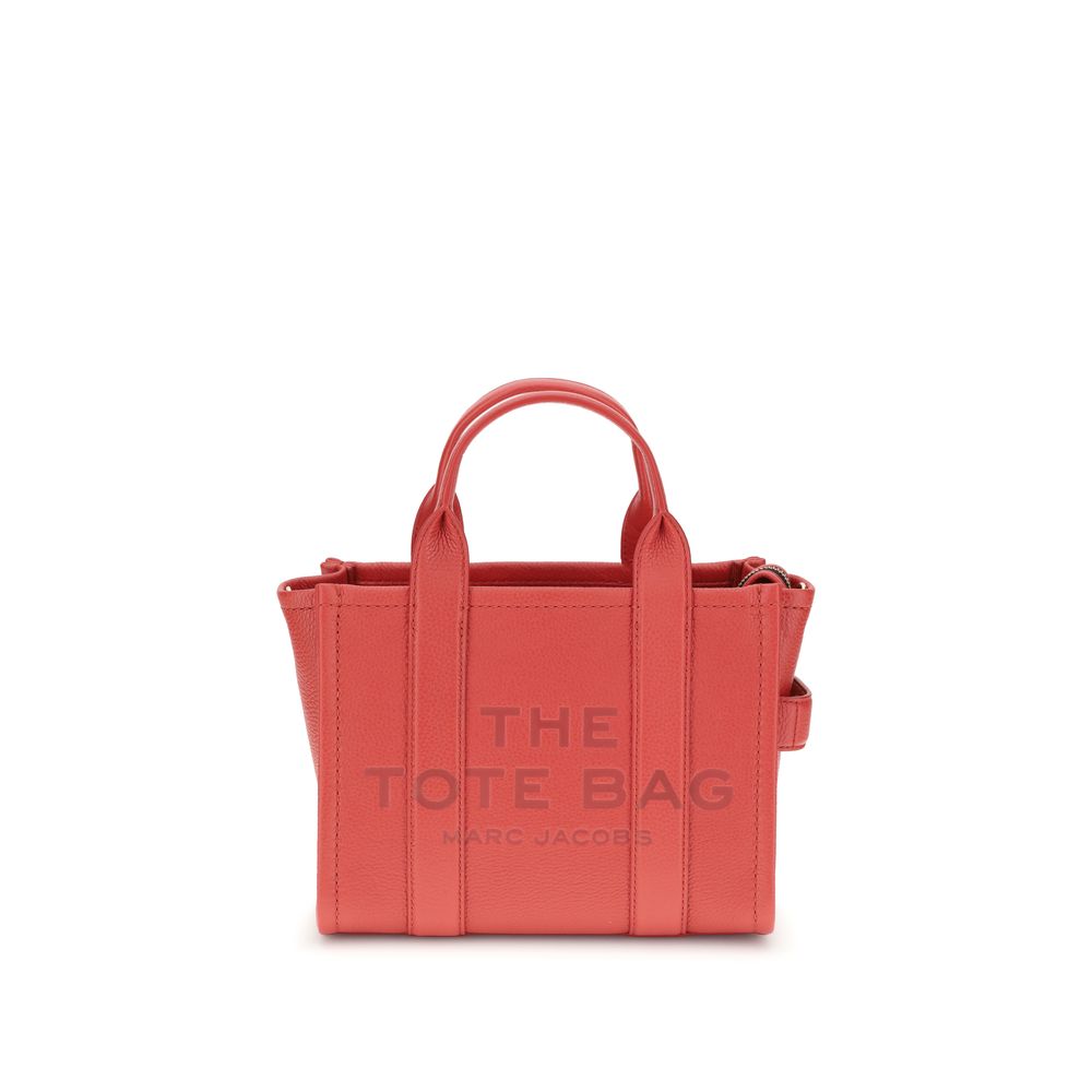 Red tote bag with 'The Tote Bag' and 'Marc Jacobs' text on a white background