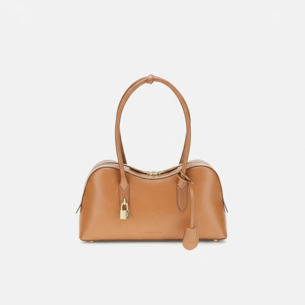 Tan handbag with a gold lock on a white background