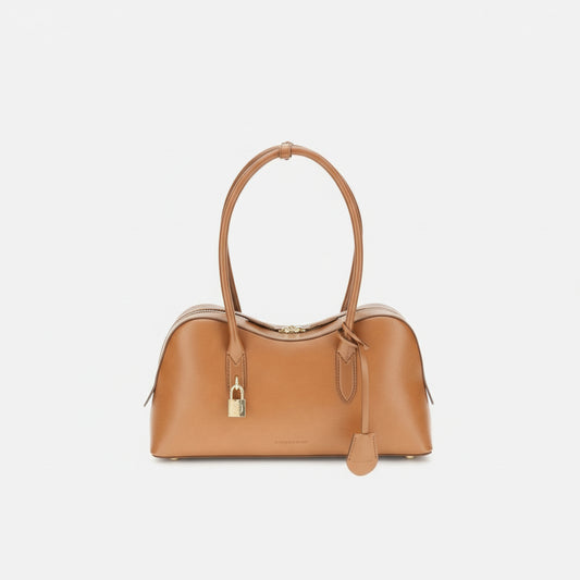 Tan handbag with a gold lock on a white background