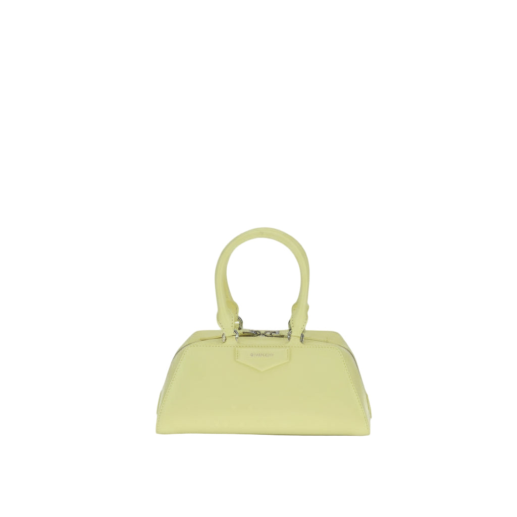 Light green handbag on a white background