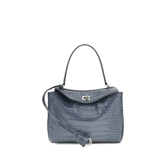 Blue handbag with a textured pattern on a white background
