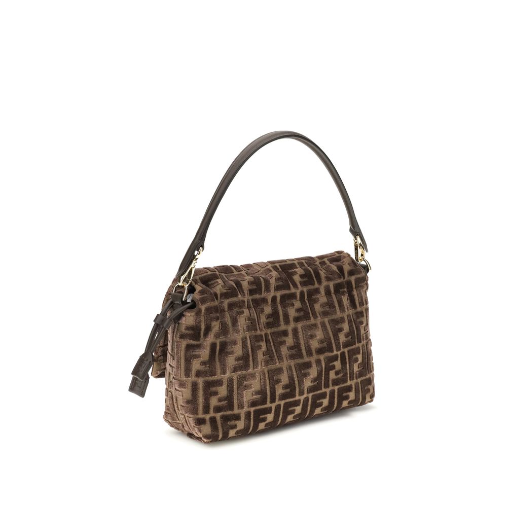 Brown handbag with a pattern on a white background