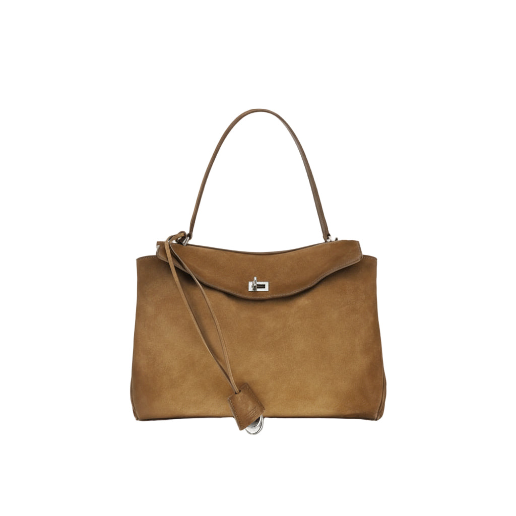 Brown handbag with a shoulder strap on a white background