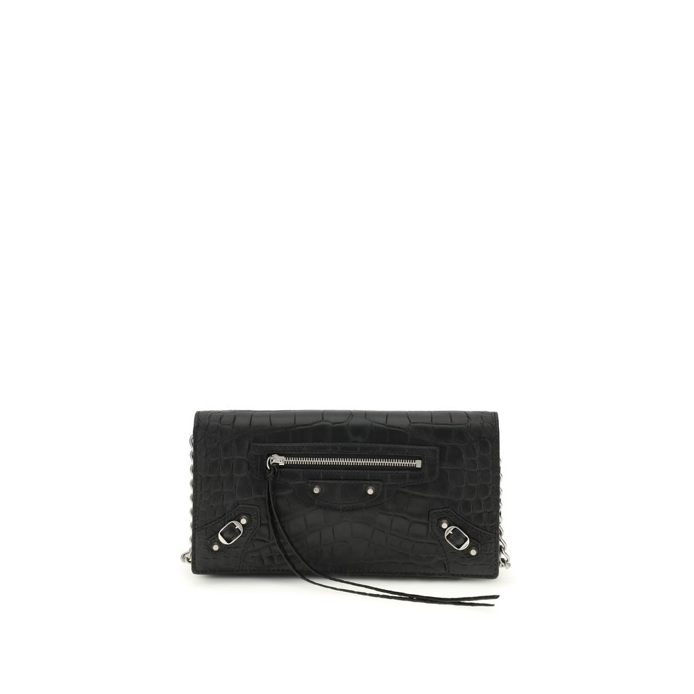 Black textured handbag with silver zippers on a white background