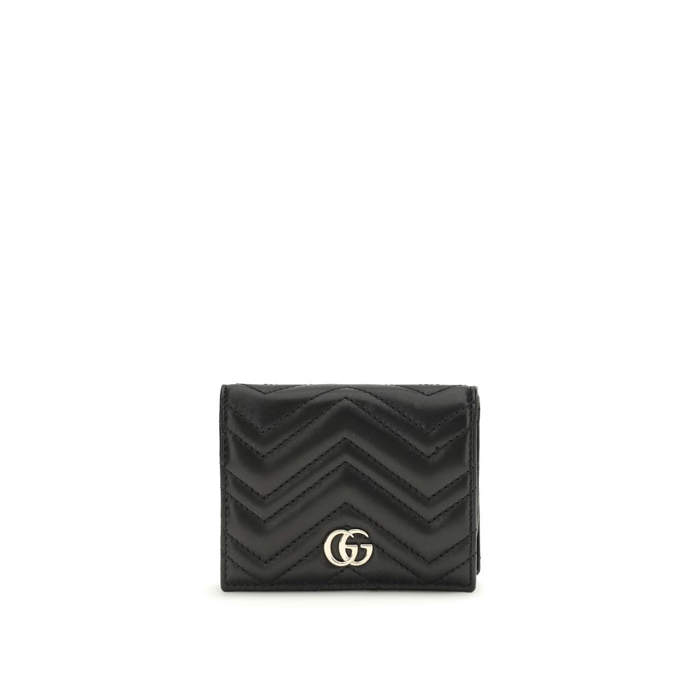 Black quilted wallet with a gold logo on a white background
