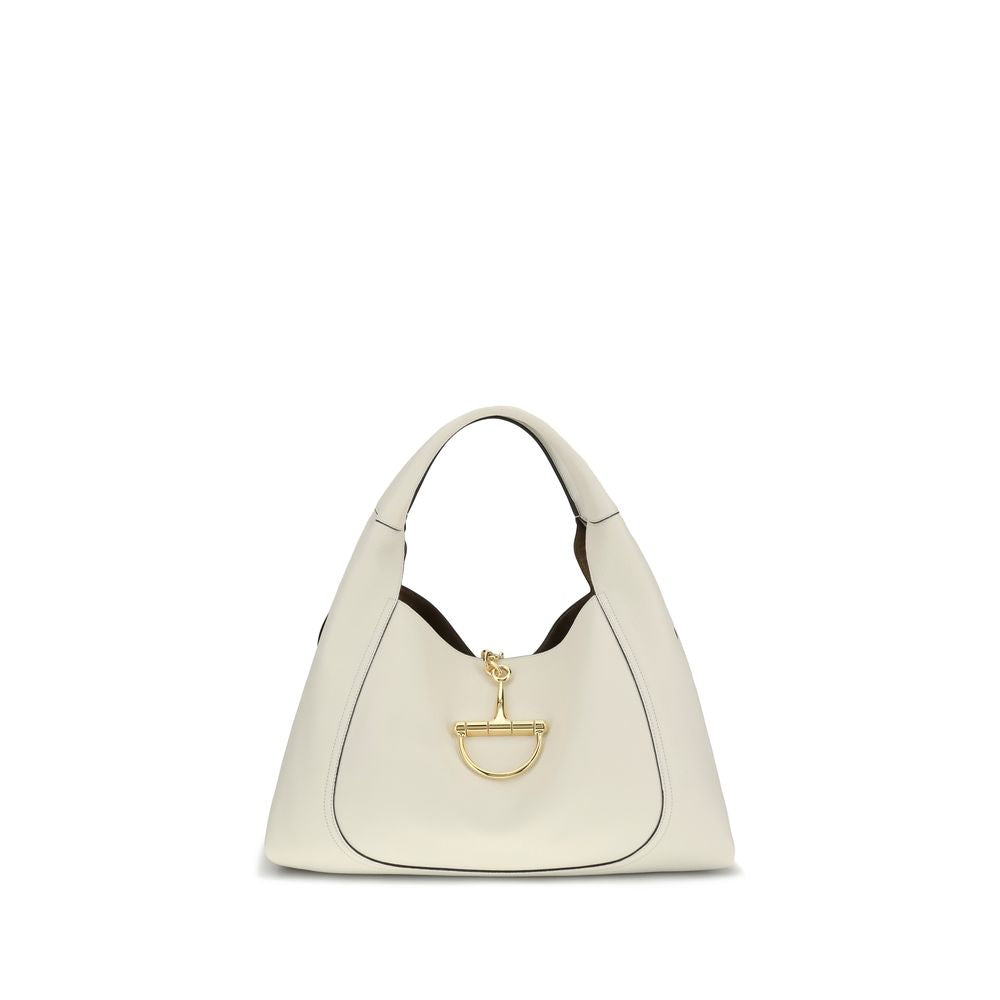 White handbag with gold clasp on a white background
