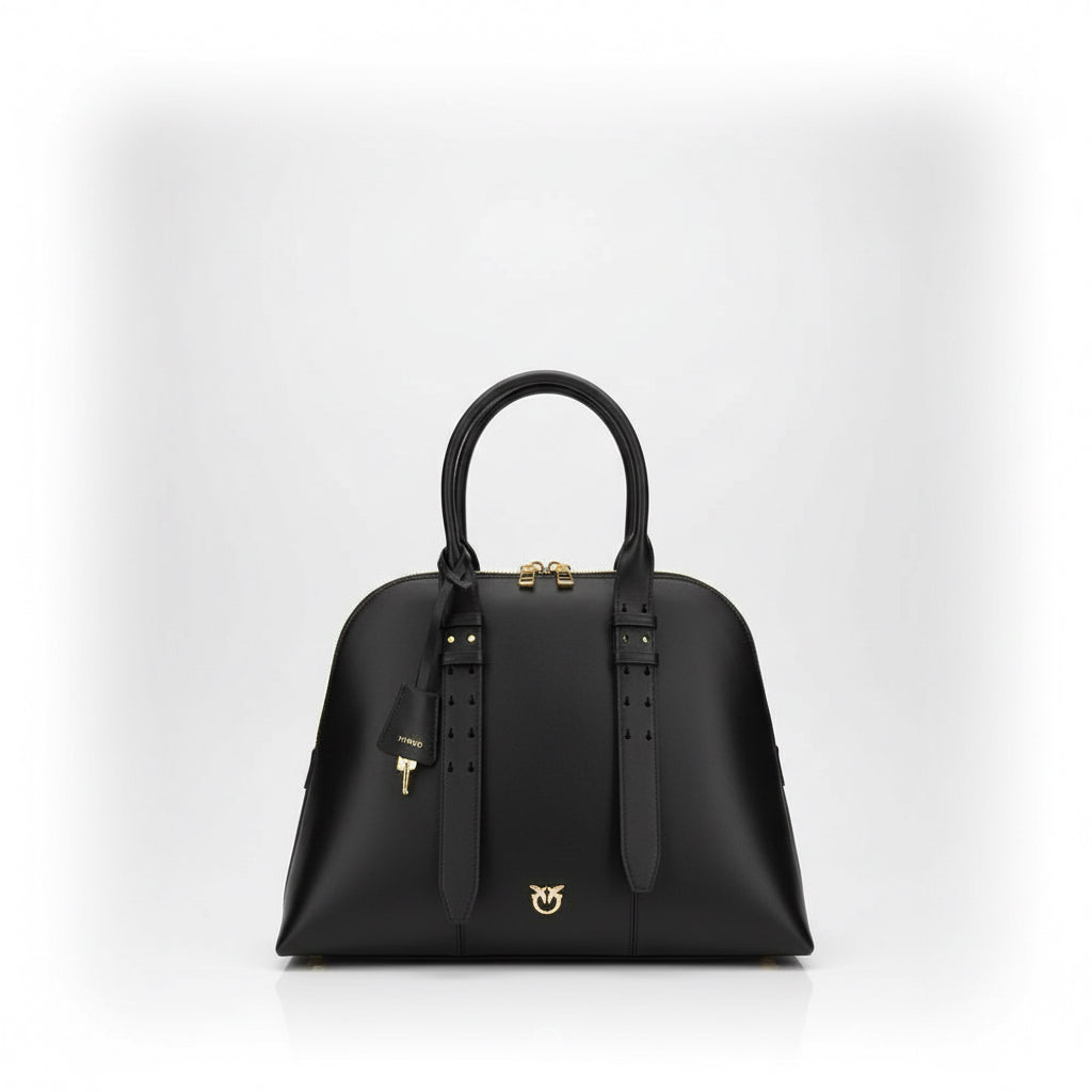 Black handbag with gold accents on a white background