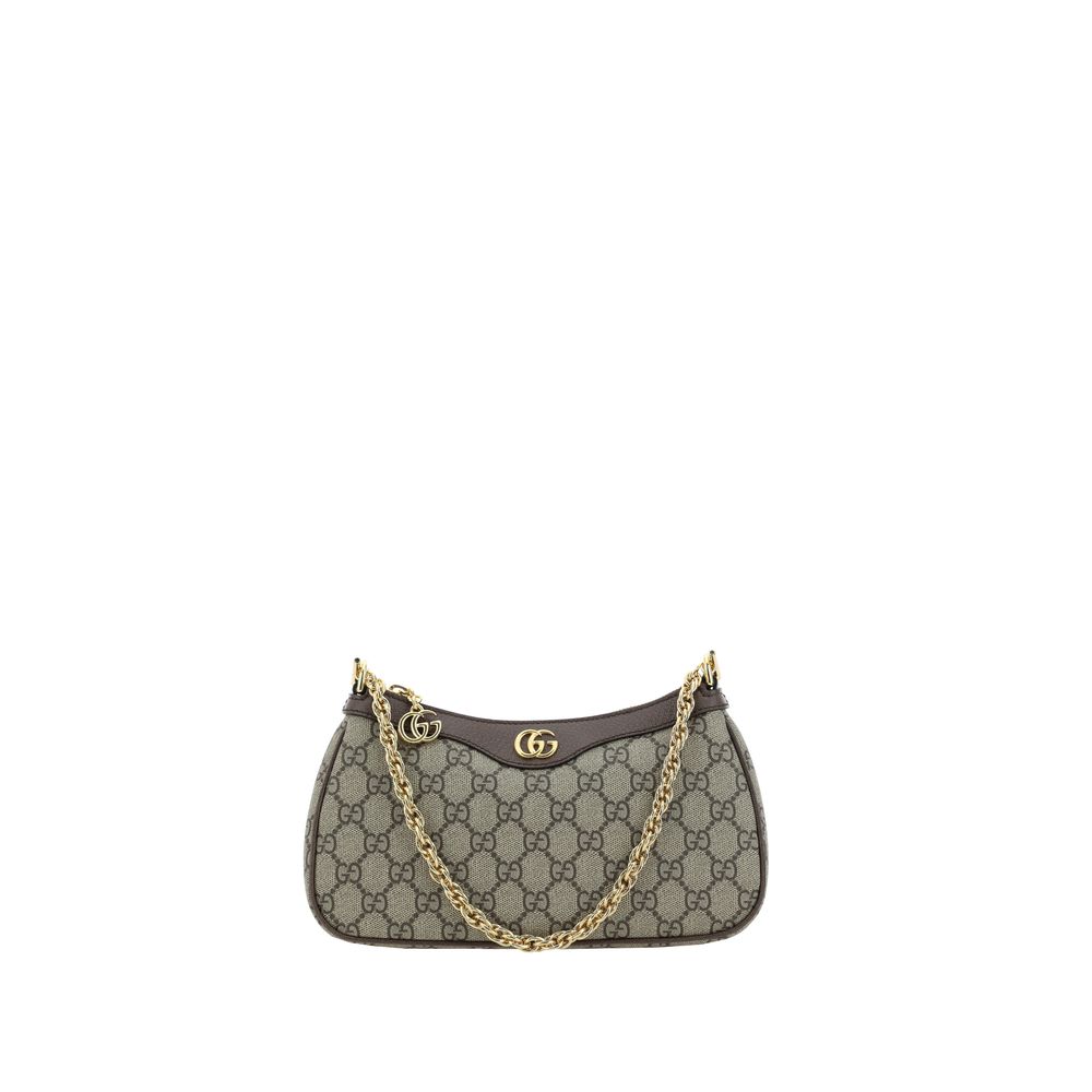 Designer handbag with gold chain strap on a white background