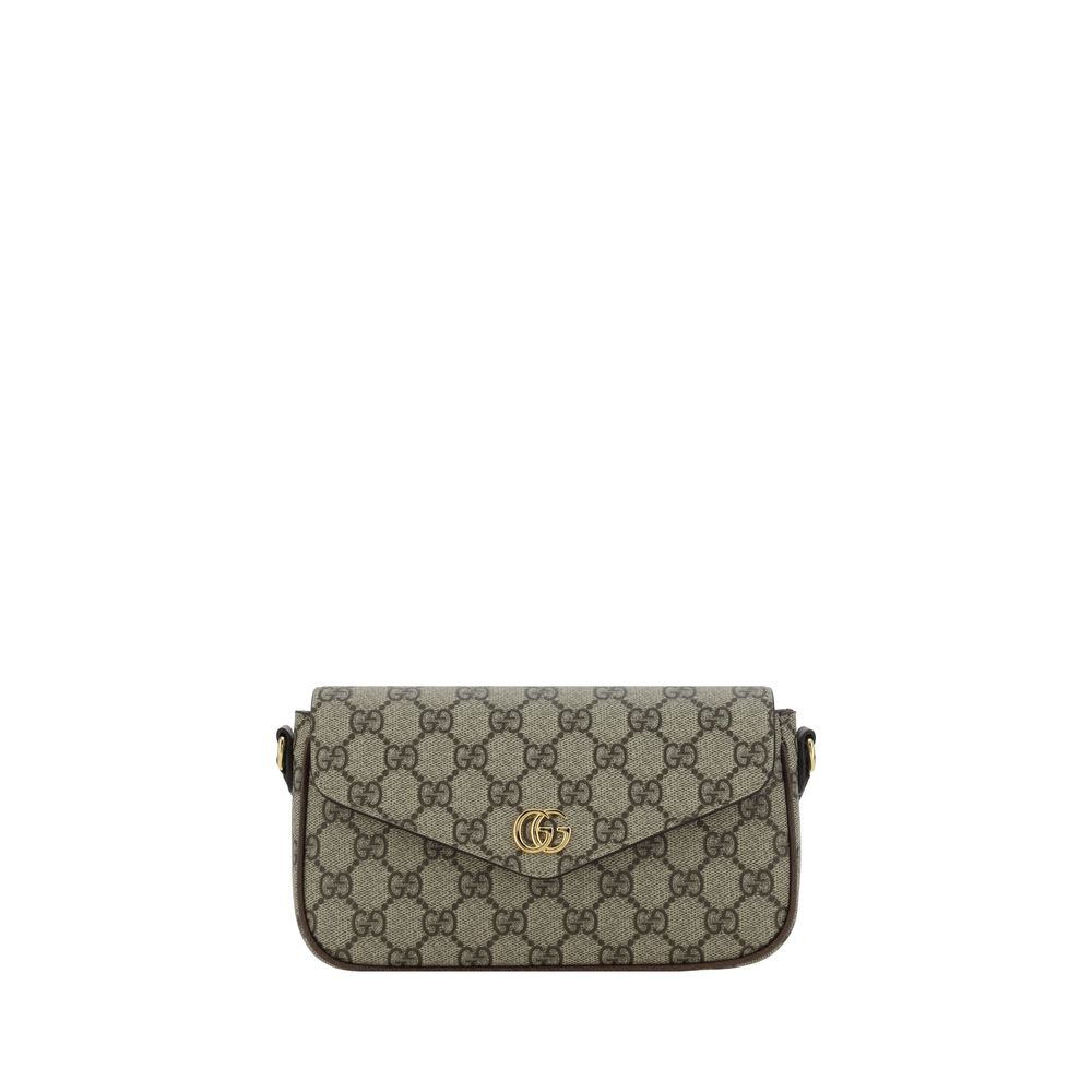 Gucci handbag with monogram pattern on a white background