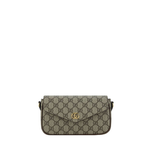 Gucci handbag with monogram pattern on a white background