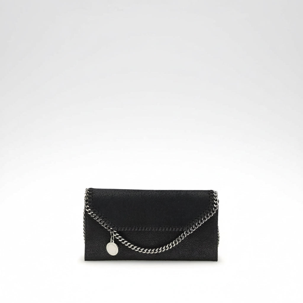 Black clutch with a chain detail on a white background